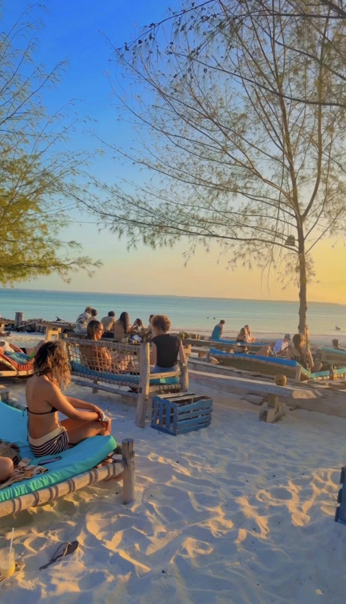 Beach gathering at sunset