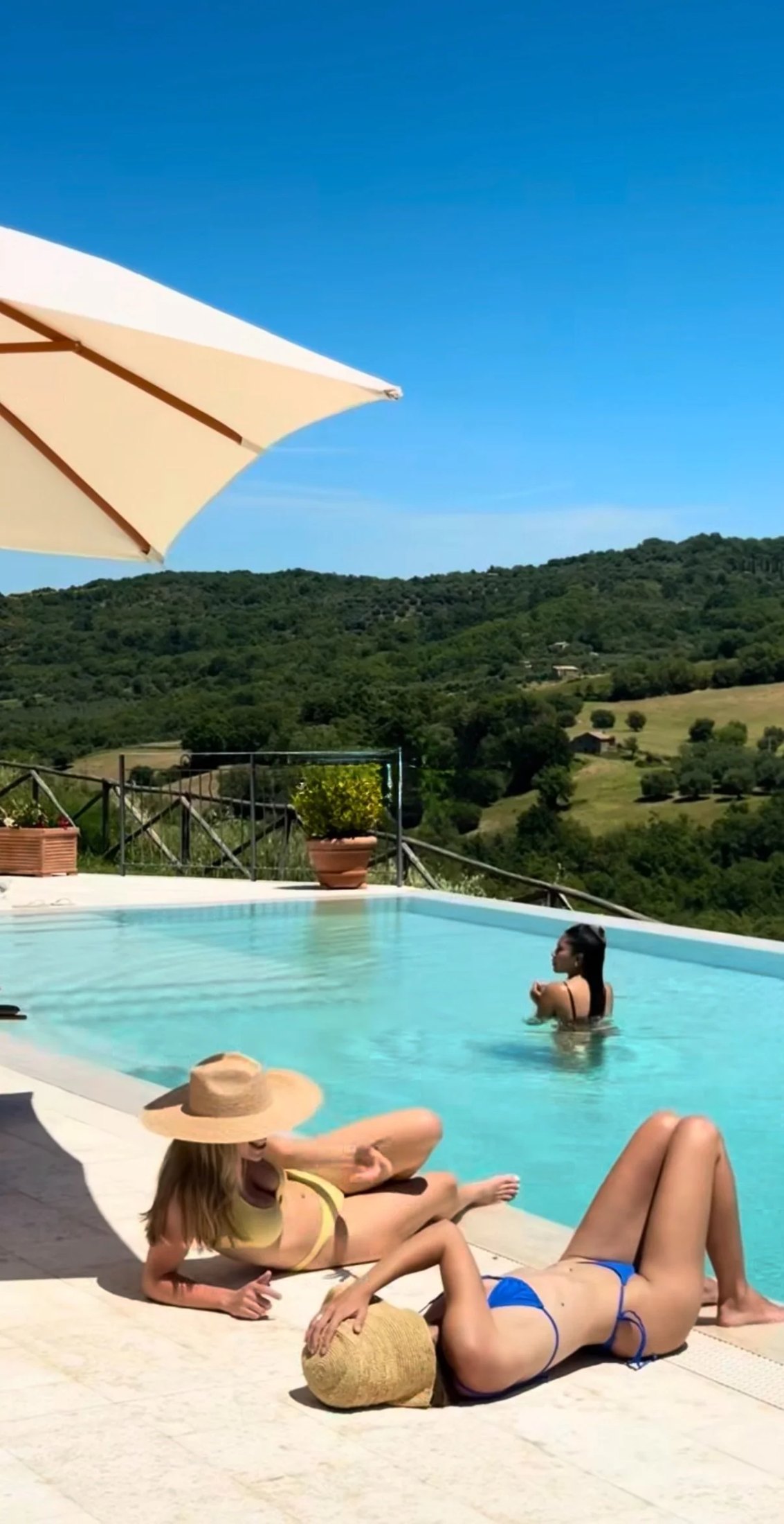 Guests relaxing by the pool
