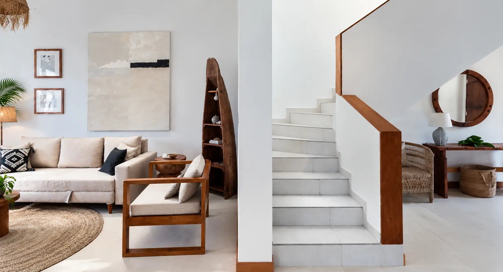 The bright stairway framed by the living room