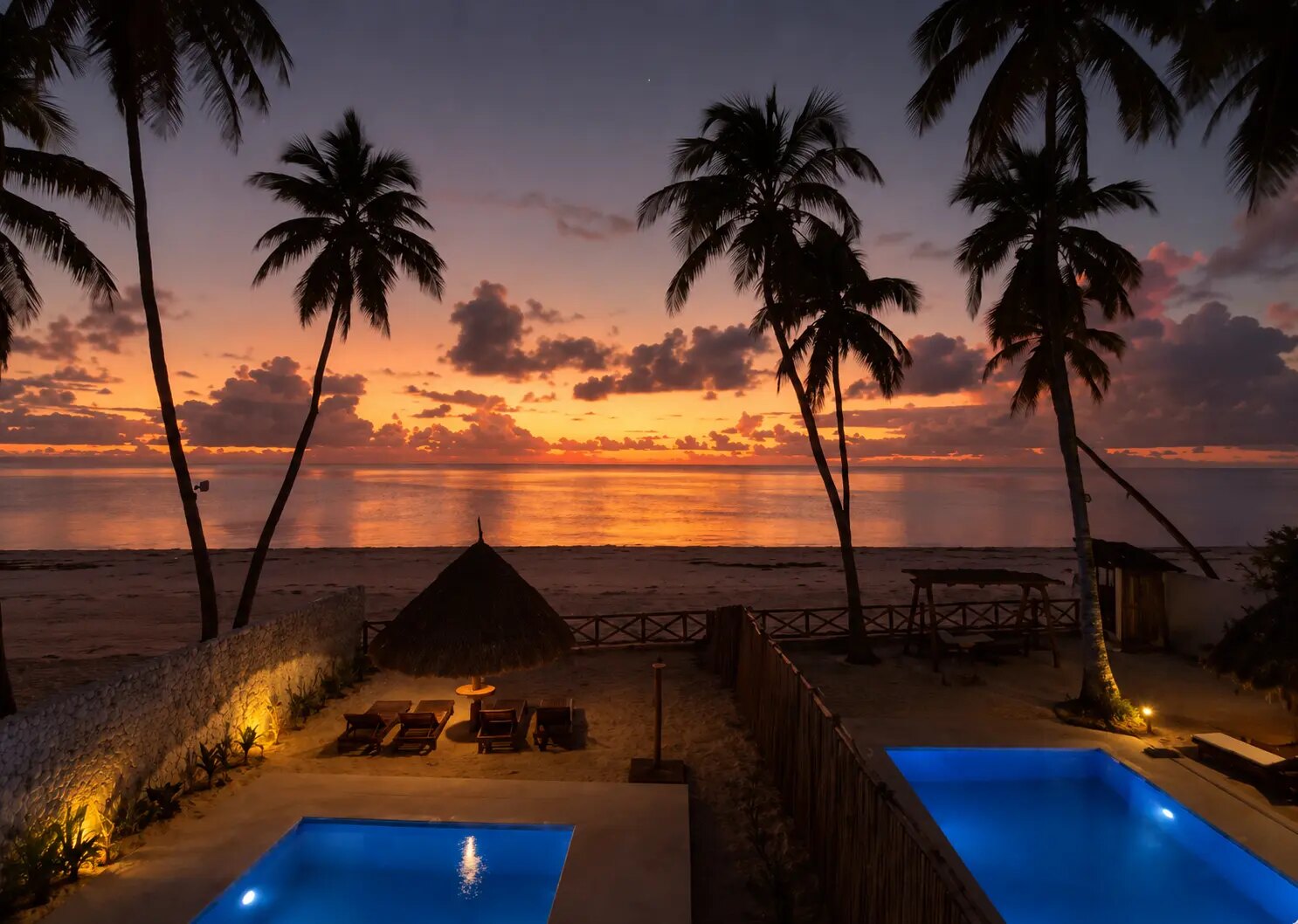 The pools glowing as the sun sets over the ocean