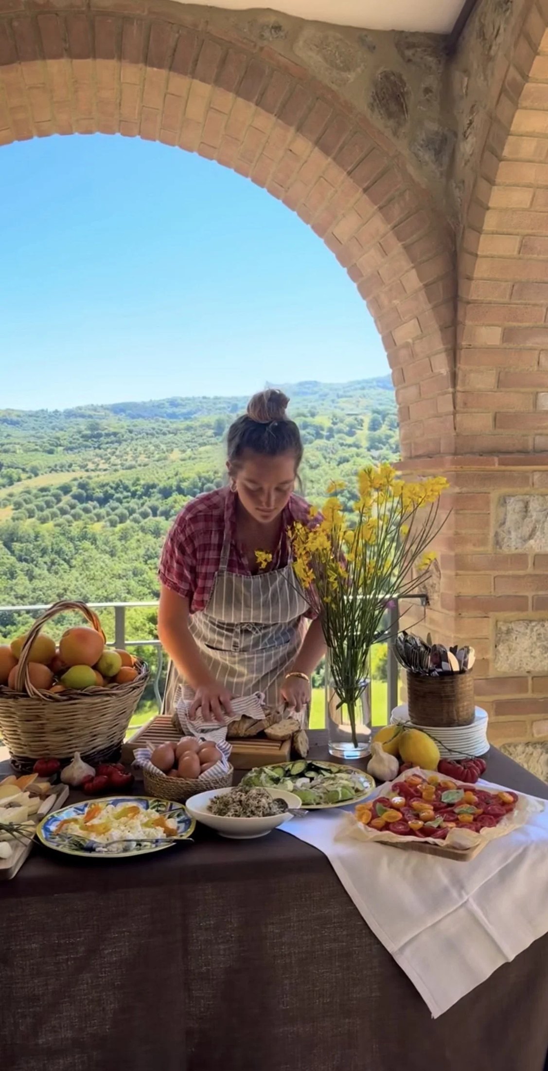Preparing a feast beneath a stone arch