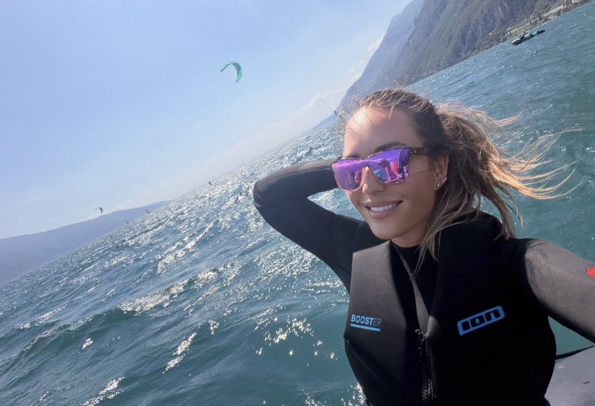 Carmen in a wetsuit on Lake Garda, ready to kitesurf