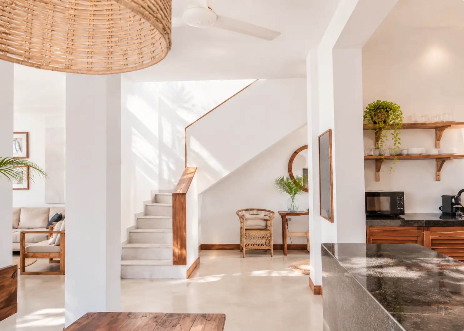 The stair hall between the living room and the kitchen