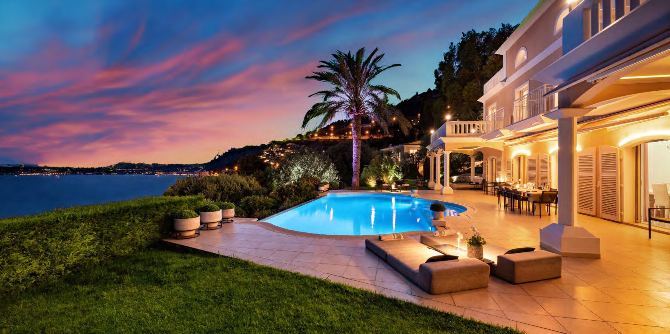 A Riviera villa and pool at dusk