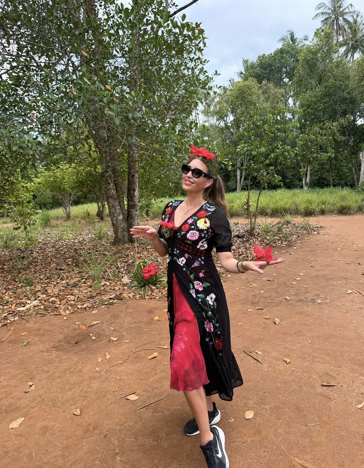 Carmen in a floral dress at a spice farm in Zanzibar